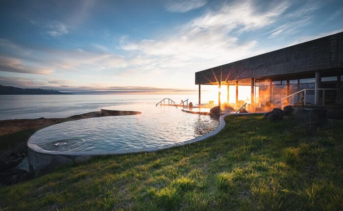 Experience nature at GeoSea sea baths in Húsavík. Warm seawater, mineral-rich, with views of mountains, Skjálfandi Bay, and the Arctic Circle.