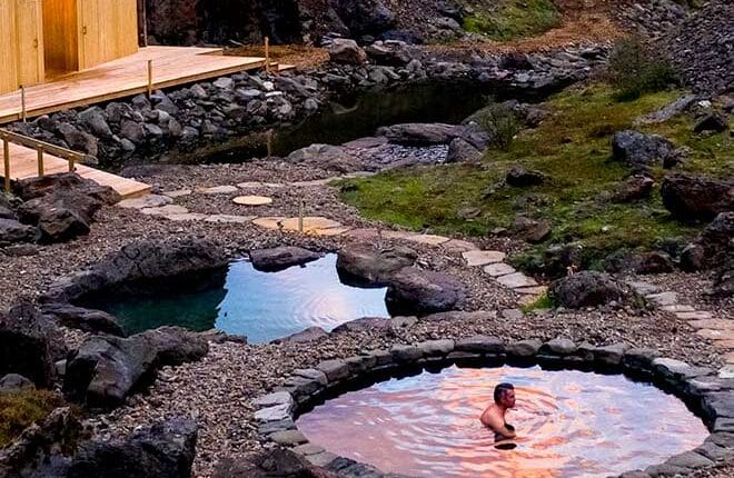 Husafell Canyon Bath Tour in Iceland. Hike through surreal highland landscapes, and afterwards relax in geothermal pools.