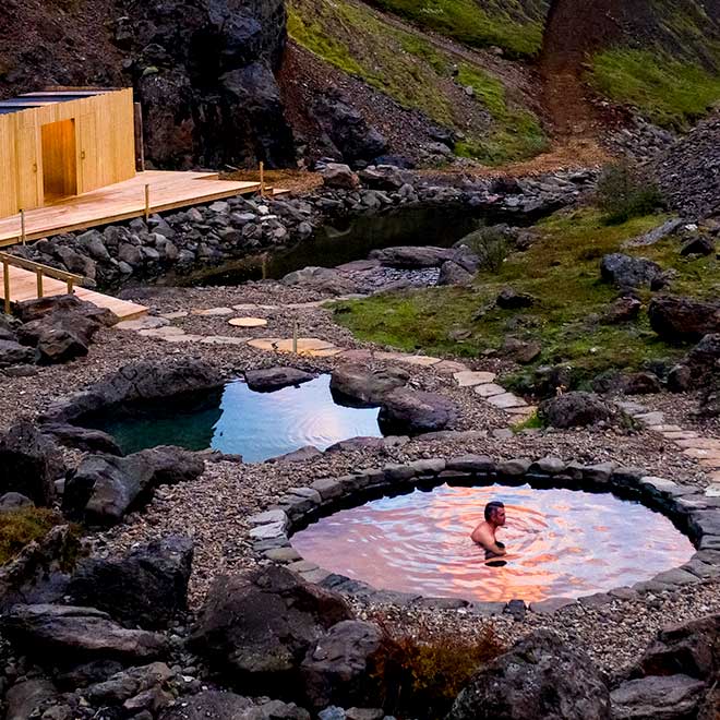 Husafell Canyon Bath Tour in Iceland. Hike through surreal highland landscapes, and afterwards relax in geothermal pools.